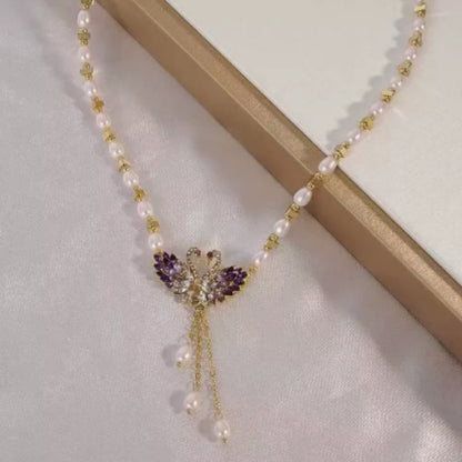 Winslow™ Collar con colgante Cisne Doble en color púrpura